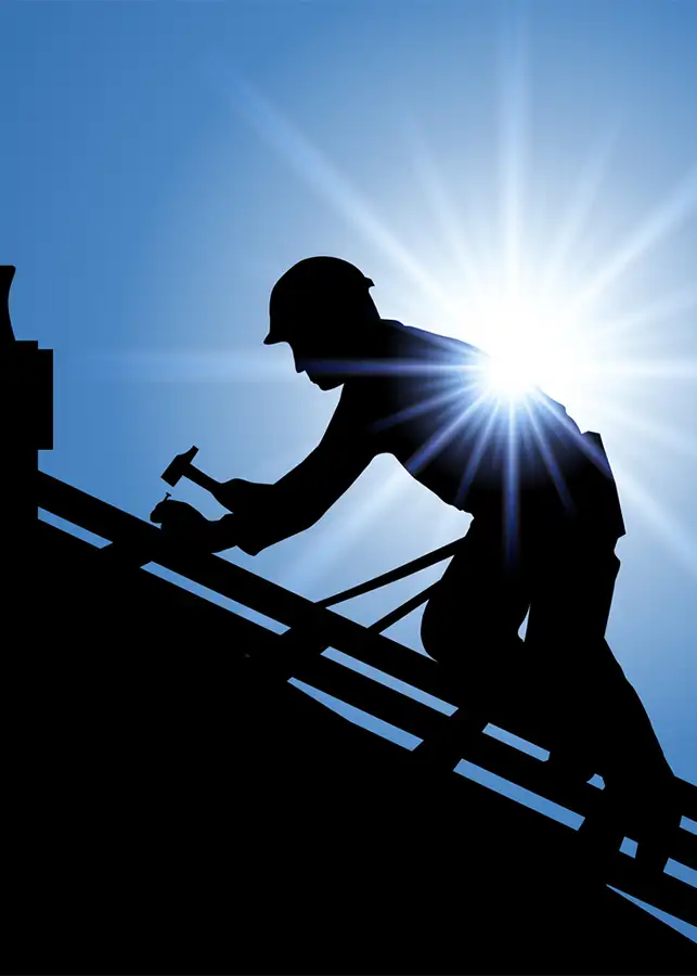 professional roofer repairing, constructing new roof silhouette on bright blue background - Madison County, Illinois